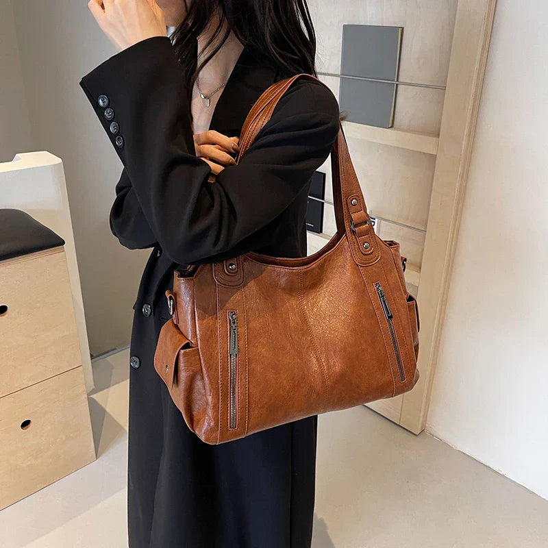 Cenvi™ schoudertas met vakken